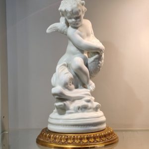 Putto en Porcelaine CAPODIMONTE sur socle en Bronze Doré
Hauteur 23 cm